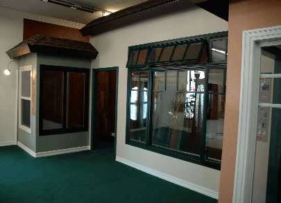 Milgard fiberglass windows awning and casements green woodclad